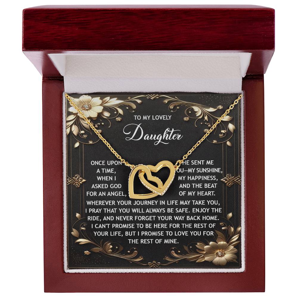 The Daughter-Be Safe - Interlocking Hearts Necklace features a gold heart-shaped pendant adorned with cubic zirconia crystals, nestled in a red box with an inspirational message for a daughter and an 18k gold finish.