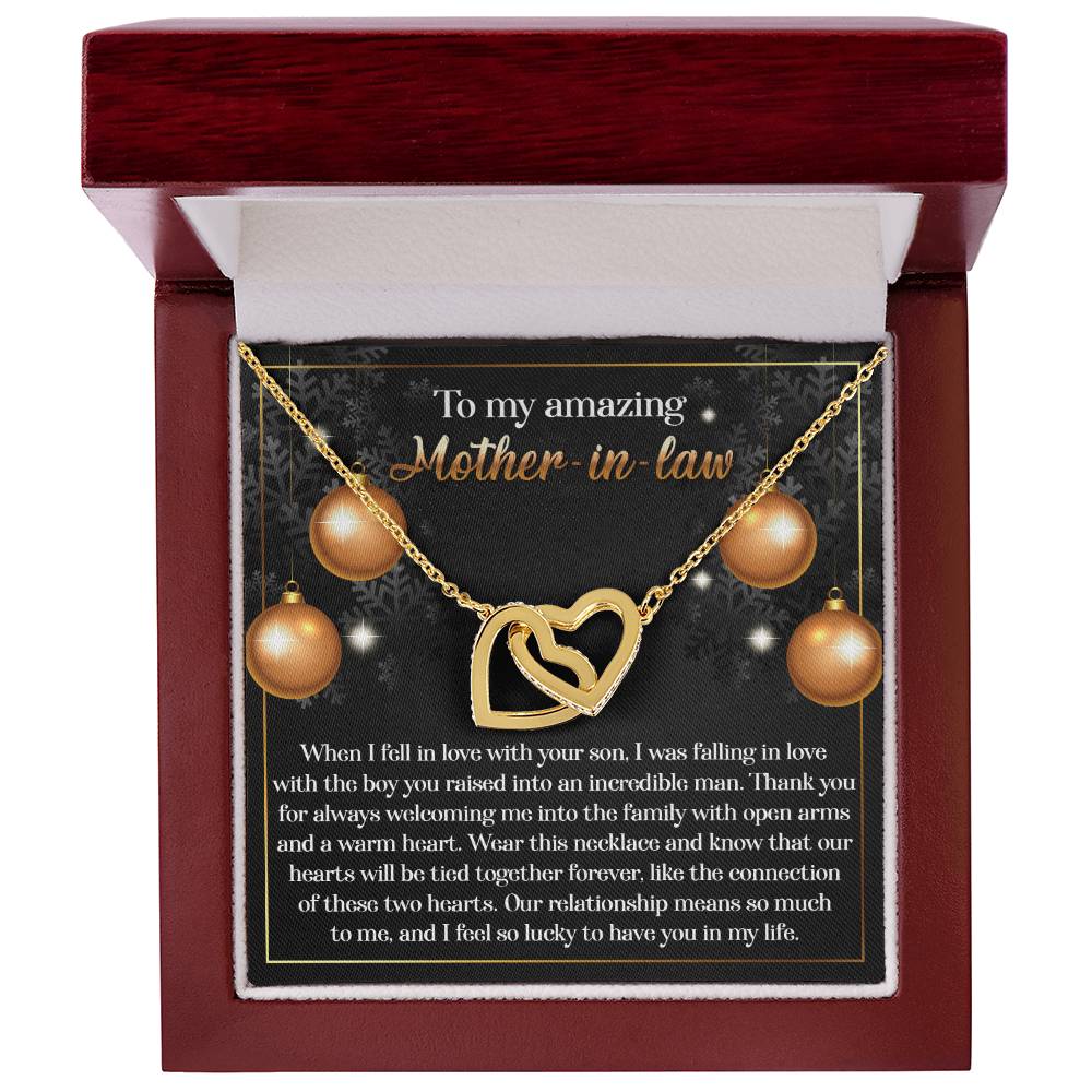 The Mother-in-Law-Two Hearts Interlocking Hearts Necklace comes in a maroon box and includes a heartfelt message for your mother-in-law. This beautiful piece showcases cubic zirconia crystals and a rose gold finish, making it an ideal symbol of love and gratitude.