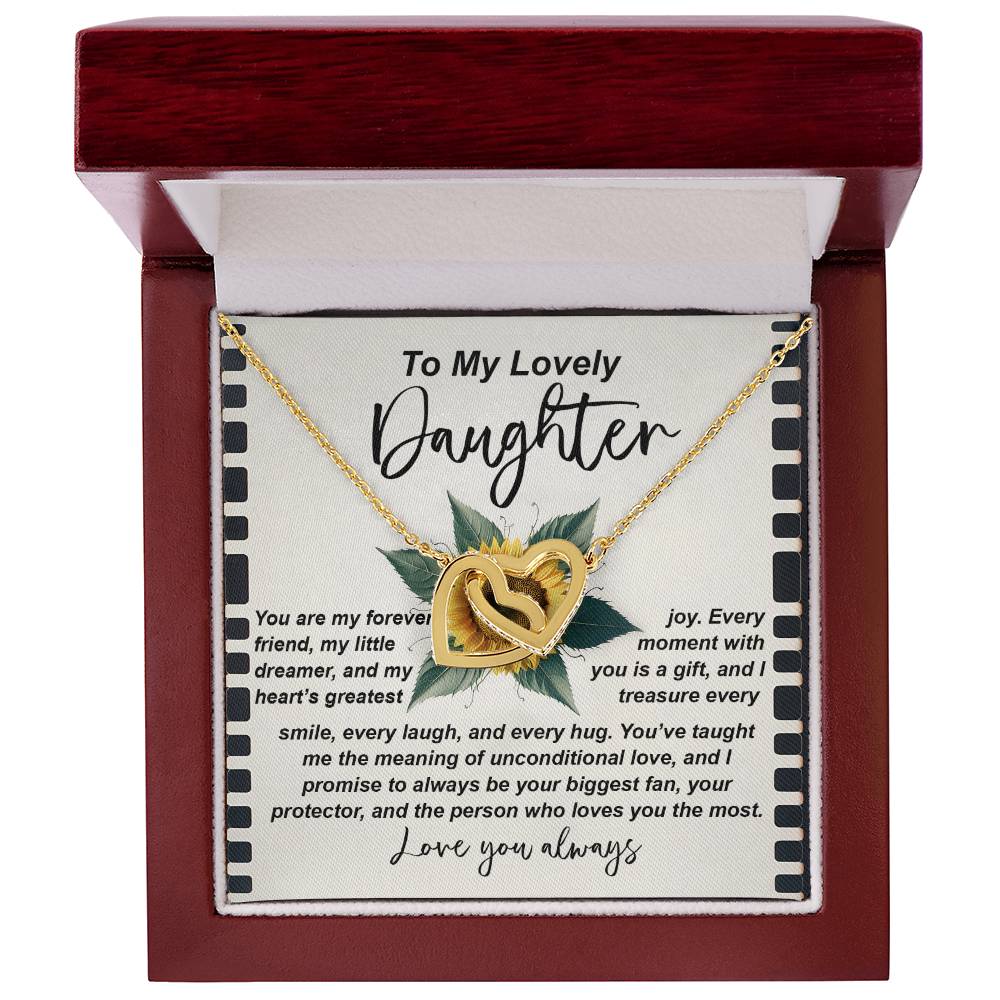 The Daughter-Little Dreamer Interlocking Hearts Necklace, finished in rose gold, is presented in a red velvet box with a message card reading "To My Lovely Daughter" and featuring a heartfelt note. Cubic zirconia crystals add an elegant touch.