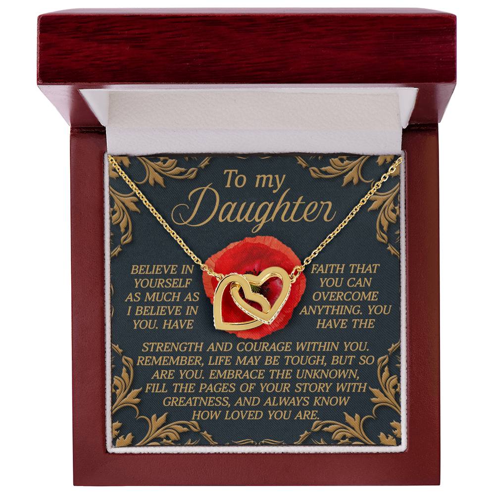 The Daughter-With Greatness - Interlocking Hearts Necklace features rose gold and cubic zirconia crystals in an open red and white box. Inside, the message "To my Daughter" is paired with an inspiring note on belief, faith, strength, and love.