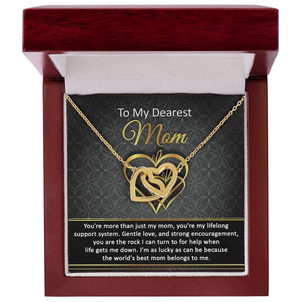 The "To Mom, Belongs To Me2 - Interlocking Hearts Necklace", adorned with cubic zirconia, comes in a red box and includes a heartfelt card for "Mom," beautifully expressing love and gratitude.