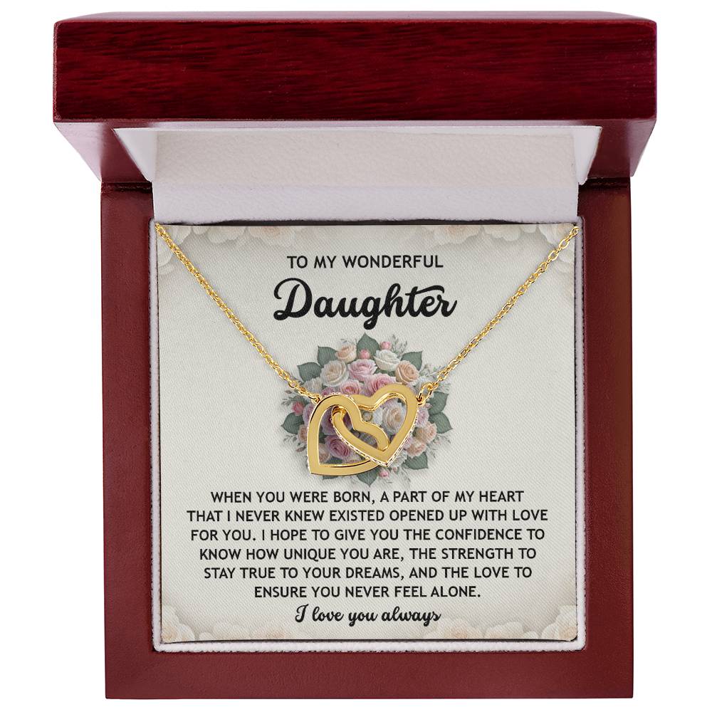 The Daughter-Stay True Interlocking Hearts Necklace, featuring sparkling cubic zirconia crystals and a rose gold finish, is presented in a wooden box with a heartfelt message about love, dreams, and confidence for a daughter.