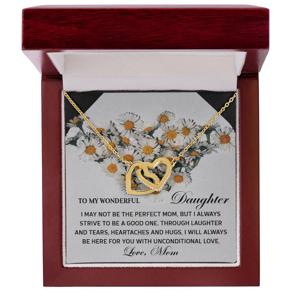 The Daughter-Unconditional Love - Interlocking Hearts Necklace features a gold heart adorned with cubic zirconia crystals in a wooden box. A "Mom to Daughter" message with a floral background makes this gift truly special.