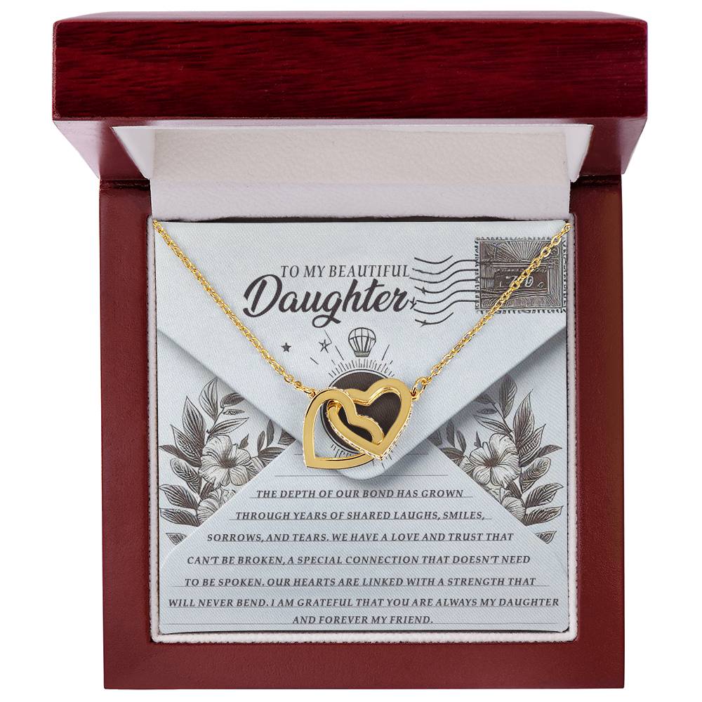 The Daughter-My Friend - Interlocking Hearts Necklace in rose gold finish is showcased in an open red box over a floral-decor card with "To My Beautiful Daughter," and sparkles with cubic zirconia crystals.