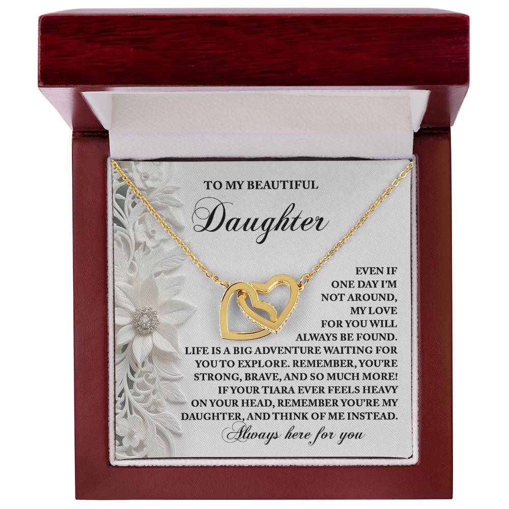 The Daughter-Think Of Me - Interlocking Hearts Necklace, with sparkling cubic zirconia and a rose gold finish, rests in a red box. It's inscribed for a daughter, expressing love, encouragement, and cherished memories.