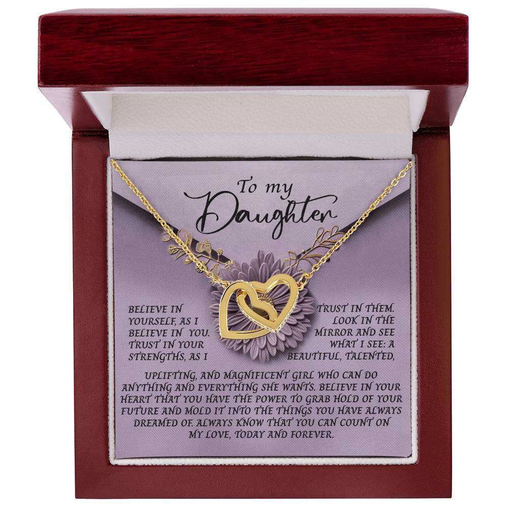 In an open red box is the "Daughter-Magnificent Girl - Interlocking Hearts Necklace" featuring a rose gold finish and cubic zirconia. A card reads: "To my Daughter," offering belief in her strength, beauty, and encouragement to trust herself.