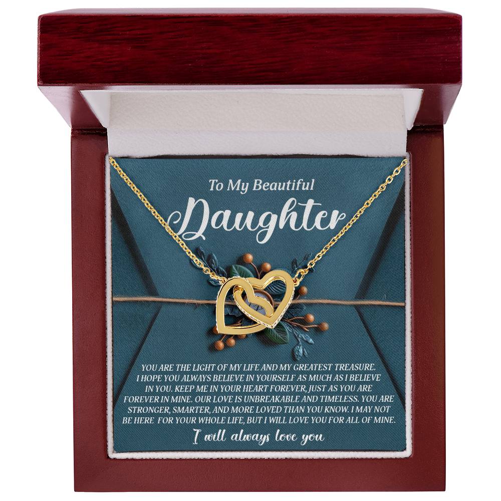 The Daughter-All Of Mine Interlocking Hearts Necklace features gold hearts with a rose gold finish in a wooden box bearing "To My Beautiful Daughter." The heartfelt message on a teal background with elegant text and decorative accents adds charm to this cherished gift.