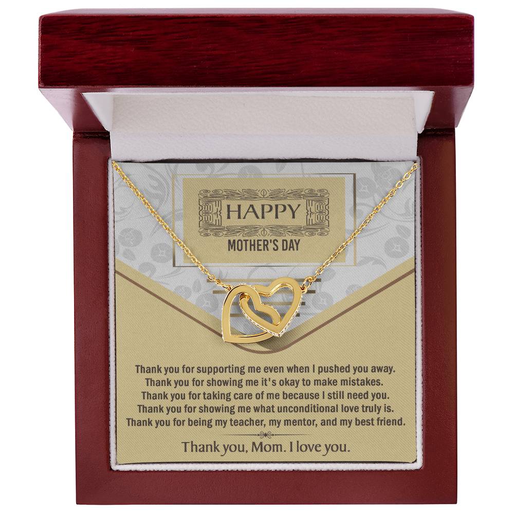 The Mother's Day-Thank You Interlocking Hearts Necklace, featuring sparkling cubic zirconia, comes in a red jewelry box with a "Happy Mother's Day" card expressing gratitude and love for mom.
