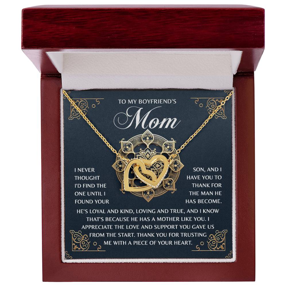 The Mom-Thankful Heart necklace, in rose gold finish, comes in a wood box with a white interior and a decorative card accented with cubic zirconia crystals, expressing deep gratitude to a boyfriend's mother for raising such a loving son.