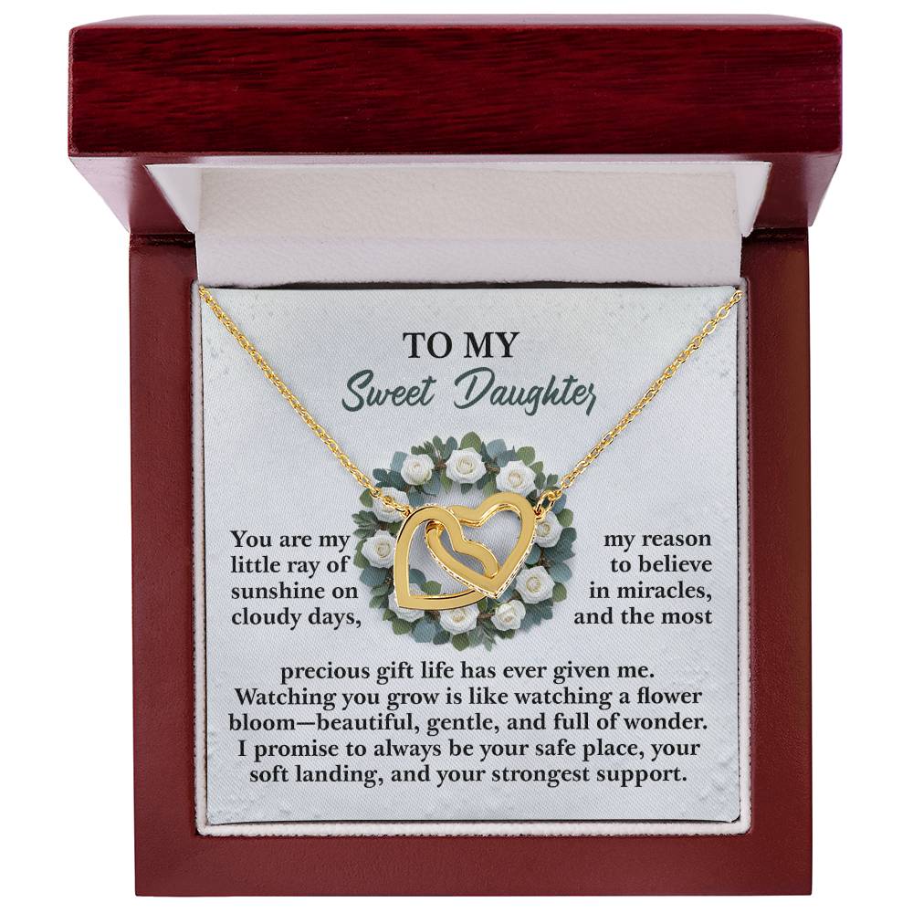A dark wood jewelry gift box holds the Daughter-Strongest Support - Interlocking Hearts Necklace with a rose gold finish. The inner lid displays "Sweet Daughter" amid small white flowers, and the necklace is adorned with cubic zirconia crystals.