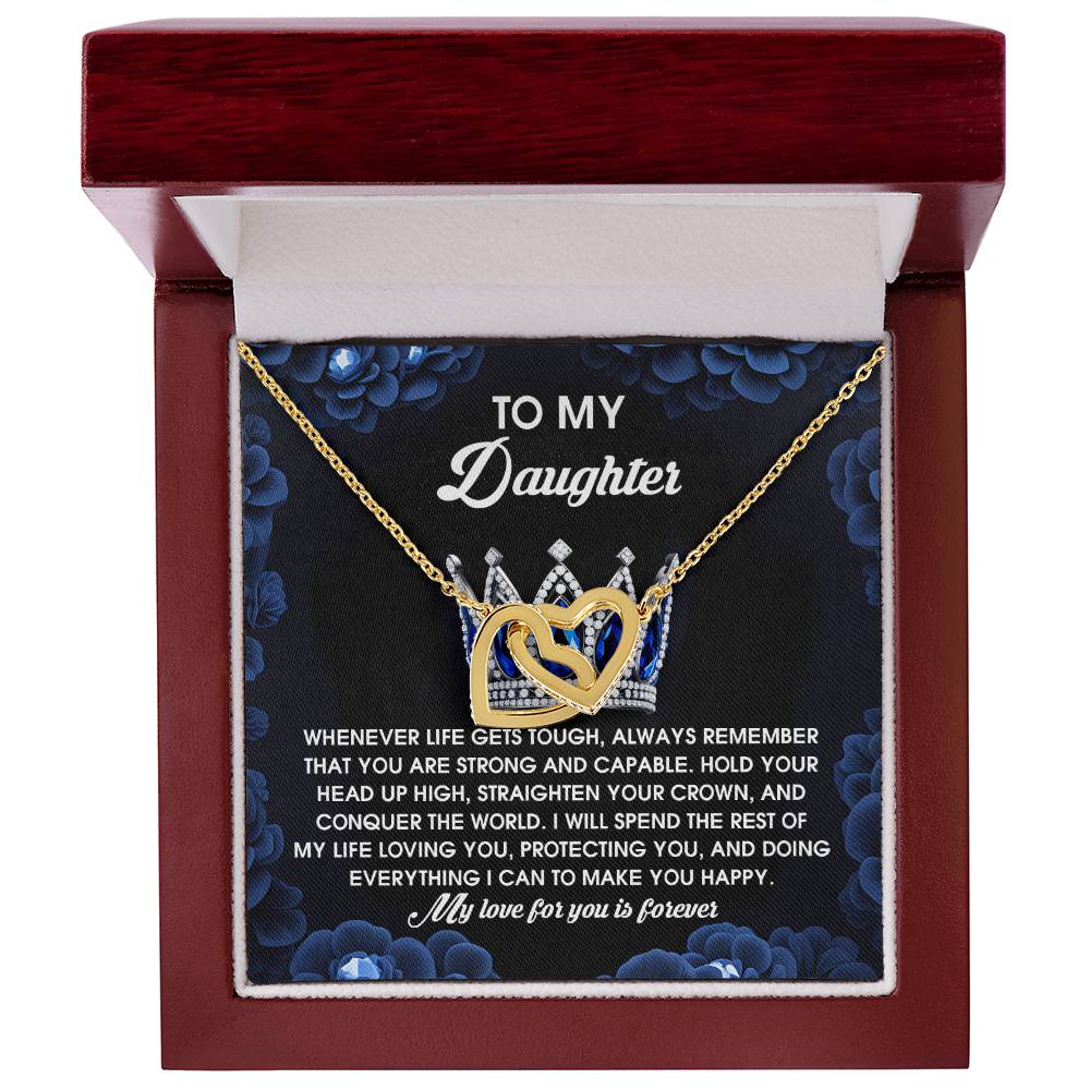 The Daughter-Make You Happy - Interlocking Hearts Necklace, featuring CZ crystals and a rose gold finish, is beautifully presented in an open red velvet box. "To My Daughter" is inscribed on the lid along with an inspirational message.