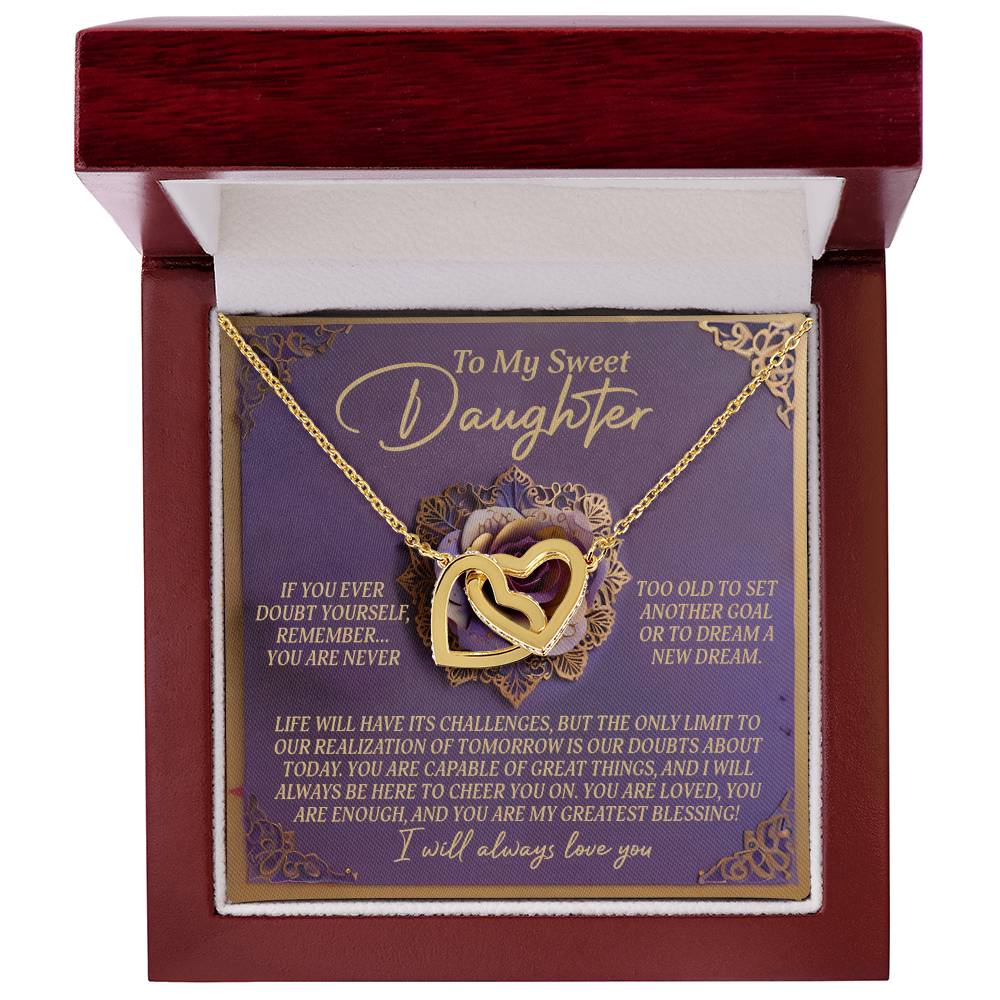 The Daughter-Greatest Blessing - Interlocking Hearts Necklace features a gold design with a rose gold finish and cubic zirconia crystals. It comes in a jewelry gift box with "To My Sweet Daughter" inside, delivering a heartfelt message. The outer box is rich red-brown in color.