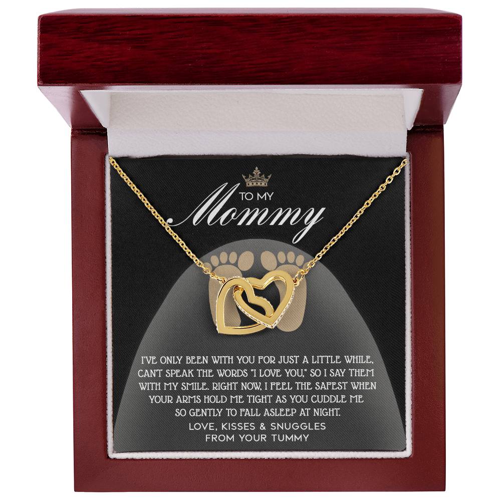 The "To Mama To Be, I Love You - Interlocking Hearts Necklace" in rose gold, adorned with cubic zirconia crystals, comes beautifully packaged in a red box with a loving message to "Mommy" from the baby.