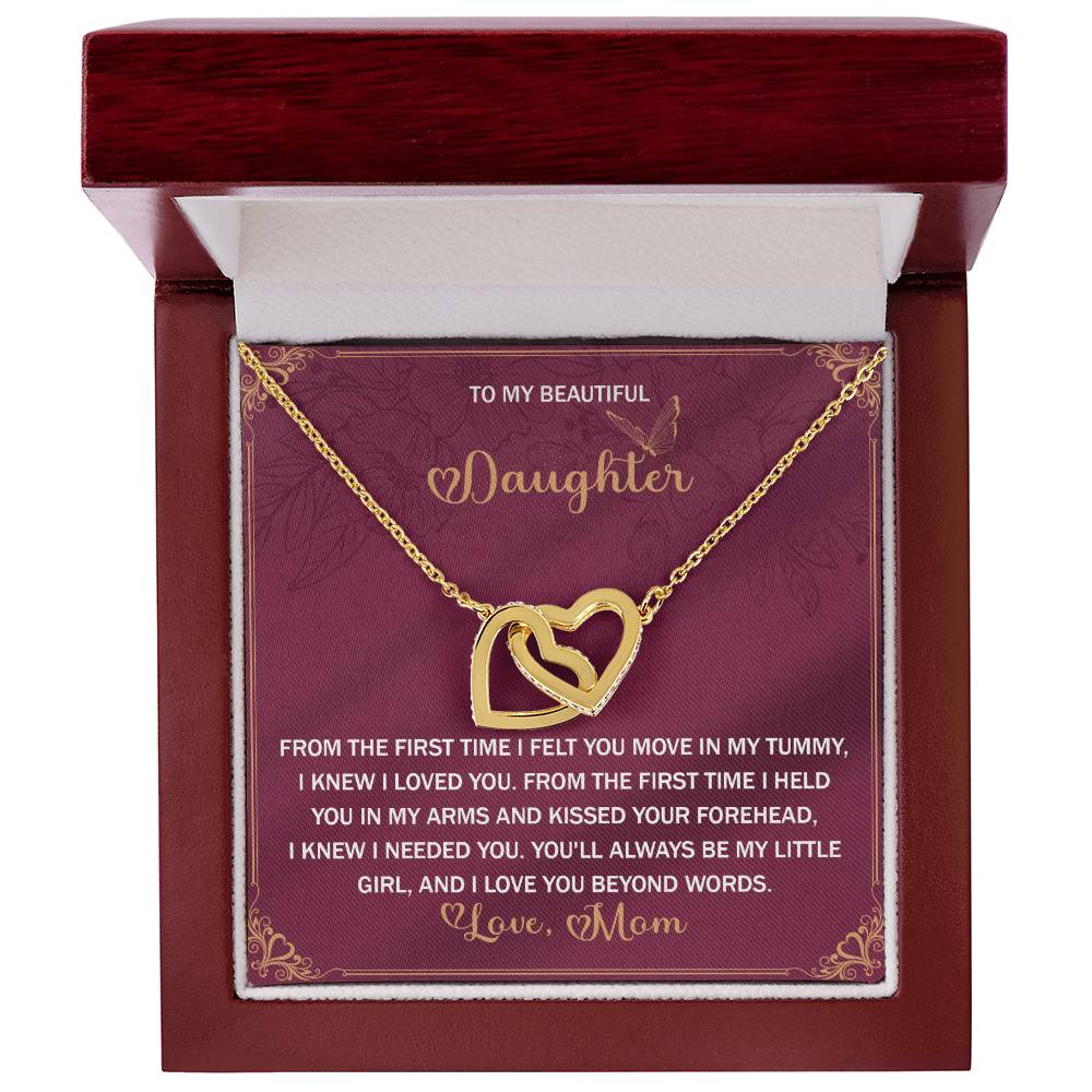 The Daughter-Beyond Words Interlocking Hearts Necklace features a rose gold finish and sparkling cubic zirconia crystals, beautifully presented in a wooden box with a heartfelt message from mother to daughter.