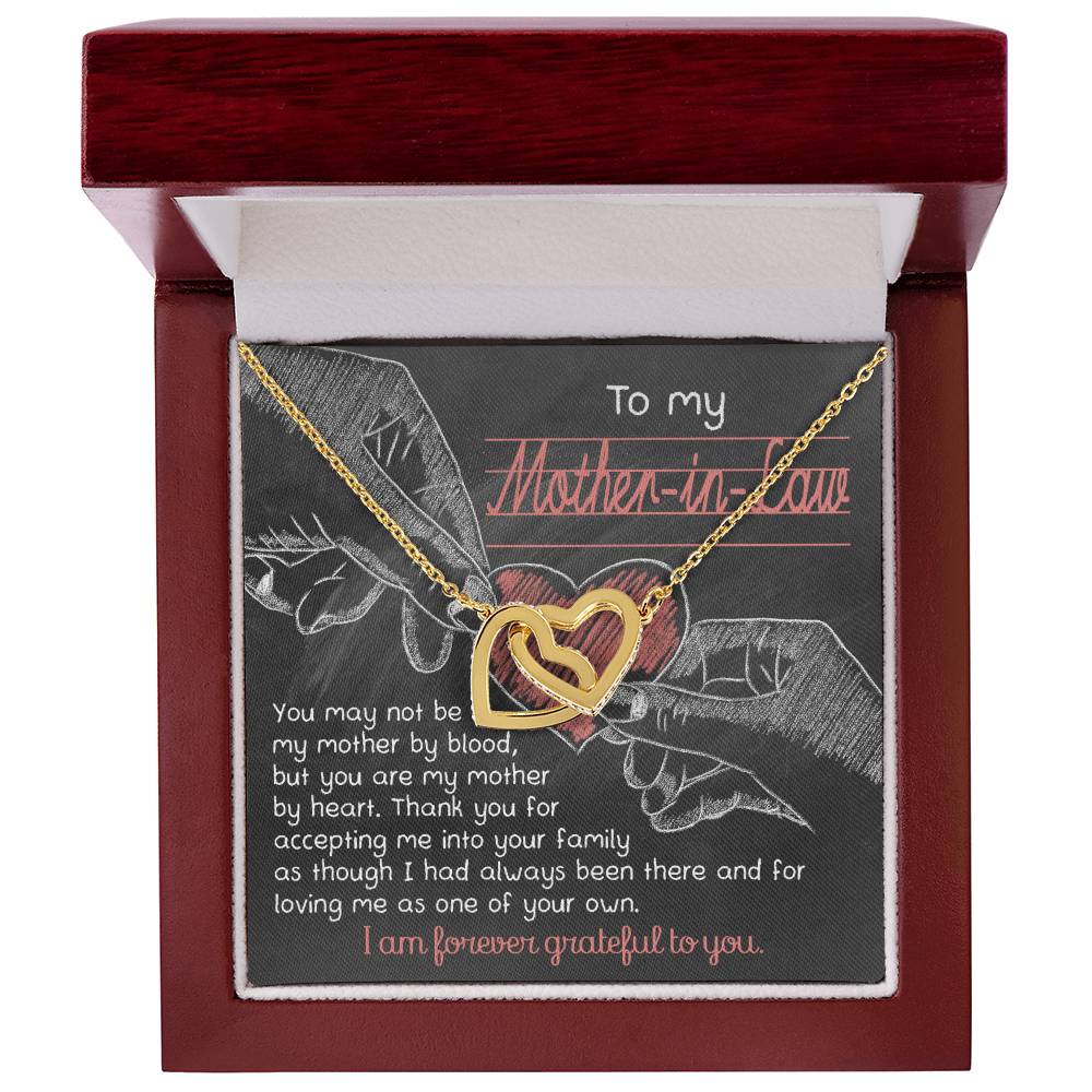 The "To Mother-In-Law, Mother By Heart - Interlocking Hearts Necklace" is adorned with cubic zirconia crystals and comes in a red and white box with a heartfelt message, making it a unique gift to beautifully express your appreciation.