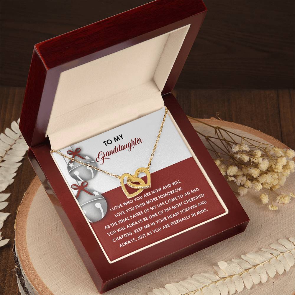 The Granddaughter-To An End - Interlocking Hearts Necklace, made from surgical steel and embellished with sparkling cubic zirconia crystals, is beautifully presented in a gift box that contains a heartfelt message for your granddaughter.
