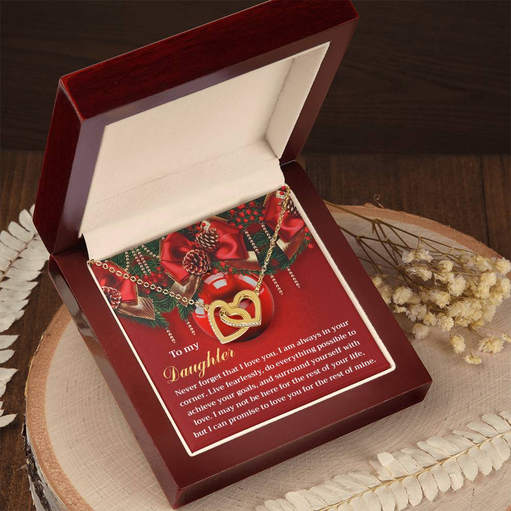 The Daughter-Achieve Your Goals Interlocking Hearts necklace, embellished with sparkling cubic zirconia crystals, is presented in an open gift box alongside a heartfelt message card for your daughter.