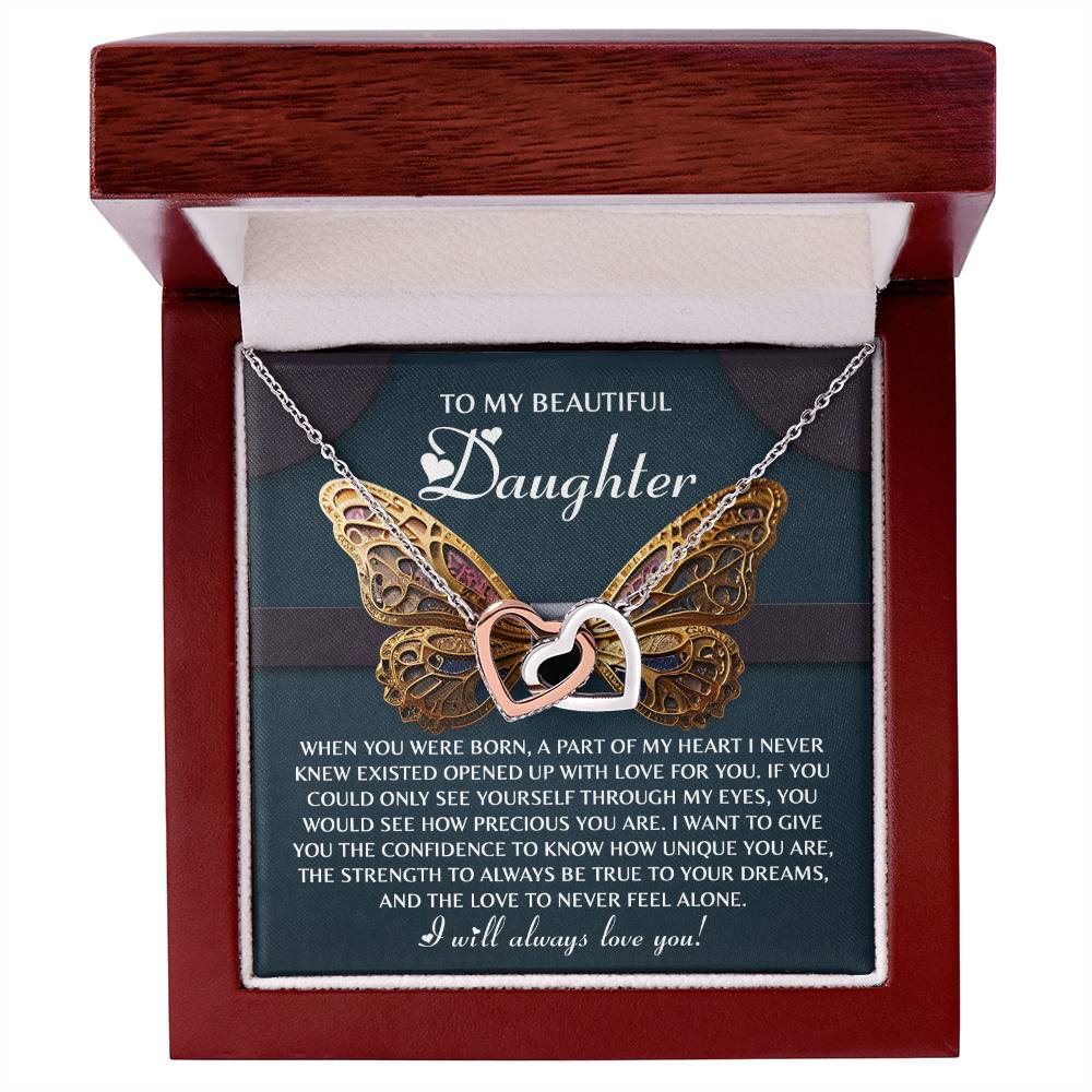 The Daughter-Never Feel Alone - Interlocking Hearts Necklace comes in a wooden box with butterfly and heart designs, featuring cubic zirconia crystals. It delivers a heartfelt message of love, pride, and encouragement to a daughter.