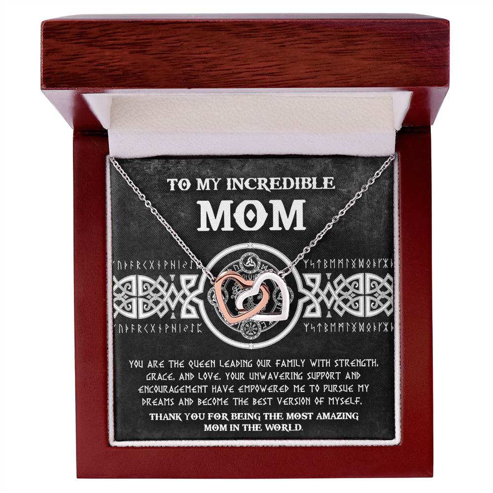 The elegant To Mom, The Queen 2 - Interlocking Hearts Necklace sparkles with cubic zirconia crystals and is nestled in a box with a heartfelt message: "To my incredible mom. Your love and encouragement have empowered me. Thank you for being the most amazing mom in the world." A perfect gift for your beloved mother.