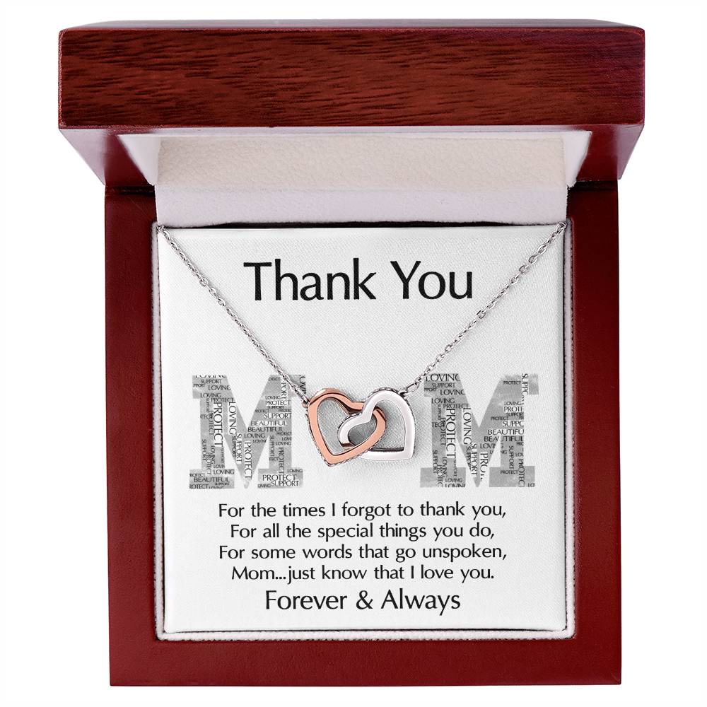 The "To Mom, Thank You - Interlocking Hearts Necklace," embellished with cubic zirconia crystals, comes in a wooden box with the message: "Thank You Mom. For all the times I forgot to thank you... Forever & Always." It's a heartfelt, personalized gift that speaks volumes.