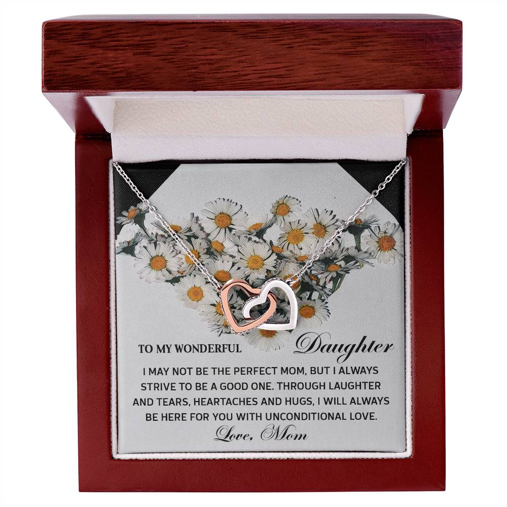 The Daughter-Unconditional Love - Interlocking Hearts Necklace, embellished with cubic zirconia crystals, comes in a charming box with daisies and a touching message from mom to daughter, making it an unforgettable keepsake.