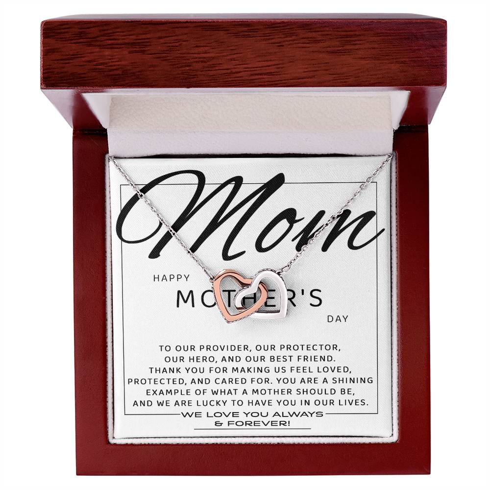 The "To Mom, Our Best Friend - Interlocking Hearts Necklace," embellished with sparkling cubic zirconia, is elegantly presented in a wooden jewelry box with a heartfelt Mother's Day message, making it the perfect personalized gift.
