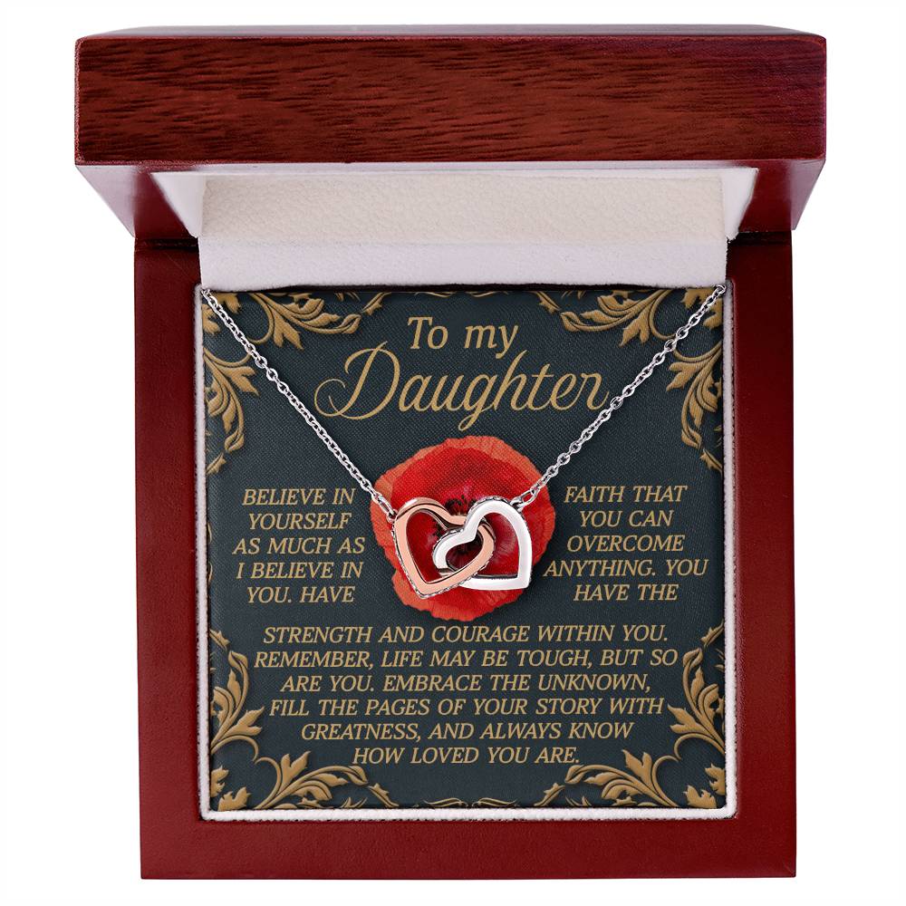 The Daughter-With Greatness - Interlocking Hearts Necklace, adorned with cubic zirconia crystals, is presented in an open wooden box. The box includes a decorative card stating "To my Daughter" along with an inspirational message about belief, faith, and love.
