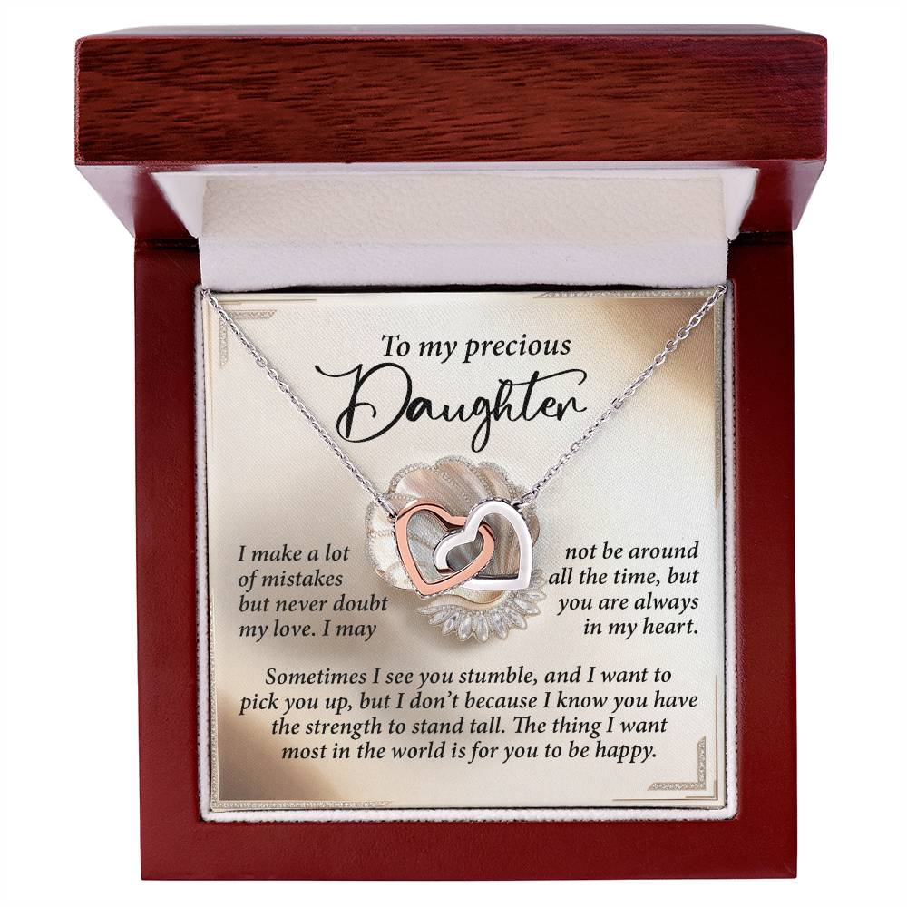 The Daughter-Be Happy - Interlocking Hearts Necklace, in an 18k yellow gold finish and adorned with cubic zirconia crystals, comes in a wooden box with the message "To my precious Daughter" and includes a heartfelt note about love and strength.