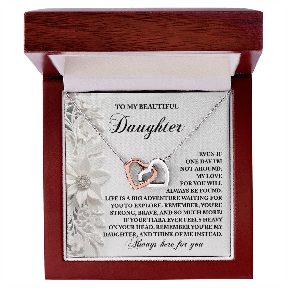 The Daughter-Think Of Me Interlocking Hearts Necklace is rose gold-plated with sparkling cubic zirconia crystals, presented in a wooden box inscribed to express a parent's love and encouragement for their daughter.