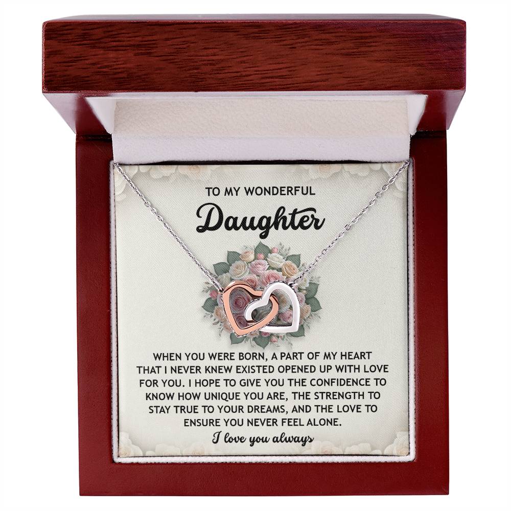 The Daughter-Stay True - Interlocking Hearts Necklace, made of surgical steel with a rose gold finish, features entwined heart pendants. Inside the box are engraved the words "To My Wonderful Daughter" and a heartfelt "I love you always.