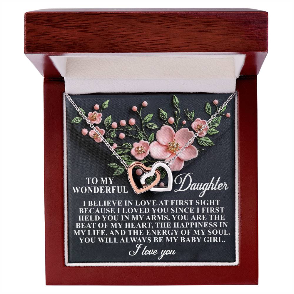 The Daughter-Love Sight jewelry box features an 18k yellow gold finish with an Interlocking Hearts necklace adorned with cubic zirconia. Inside, a floral design and a heartfelt message express love and happiness to a daughter, calling her "baby girl.