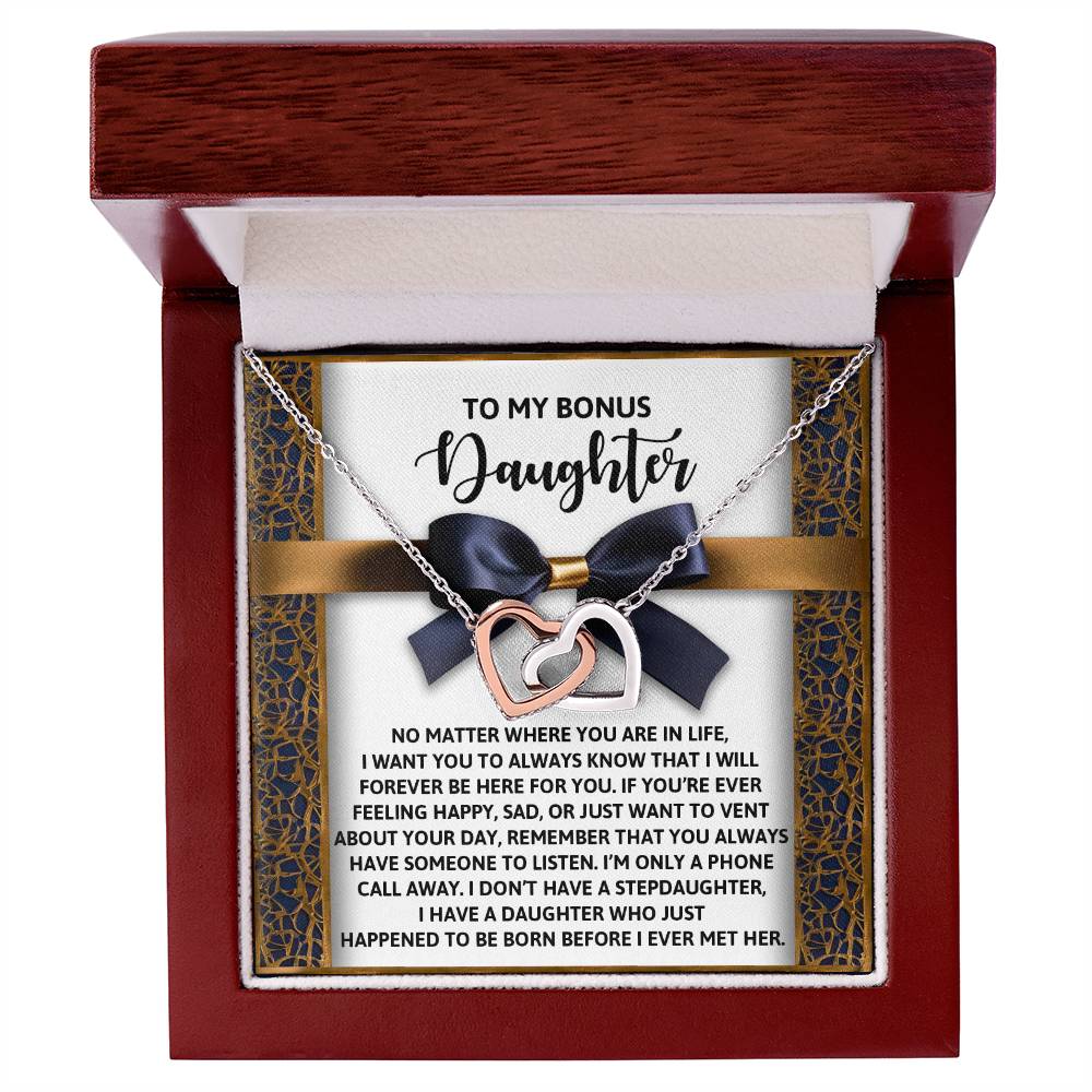 The Daughter-Have Someone necklace features interlocking hearts in a gift box, engraved with "To my bonus daughter" and supportive messages. Made from surgical steel with rose gold finish, it sparkles with cubic zirconia crystals, and the box is adorned with a charming bow accent.