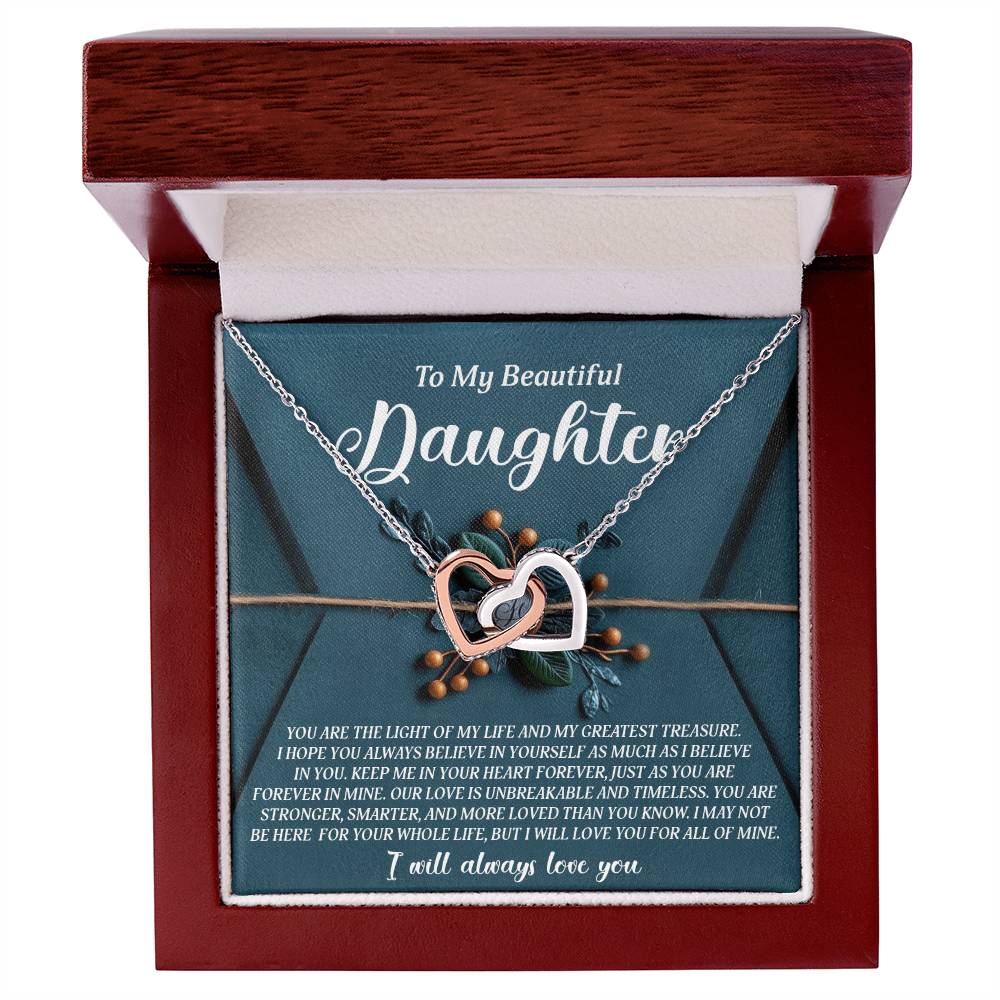 An open jewelry box reveals the Daughter-All Of Mine - Interlocking Hearts Necklace with cubic zirconia crystals, accompanied by an inscription card starting with "To My Beautiful Daughter," expressing love and appreciation.