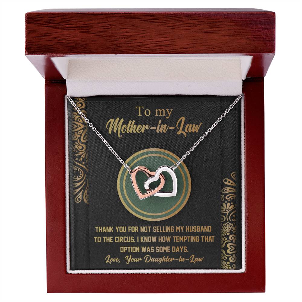 Gift your mother-in-law the "To Mother-In-Law, Thank You" Interlocking Hearts Necklace, adorned with sparkling cubic zirconia crystals and presented in a charming wooden box with a humorous message.