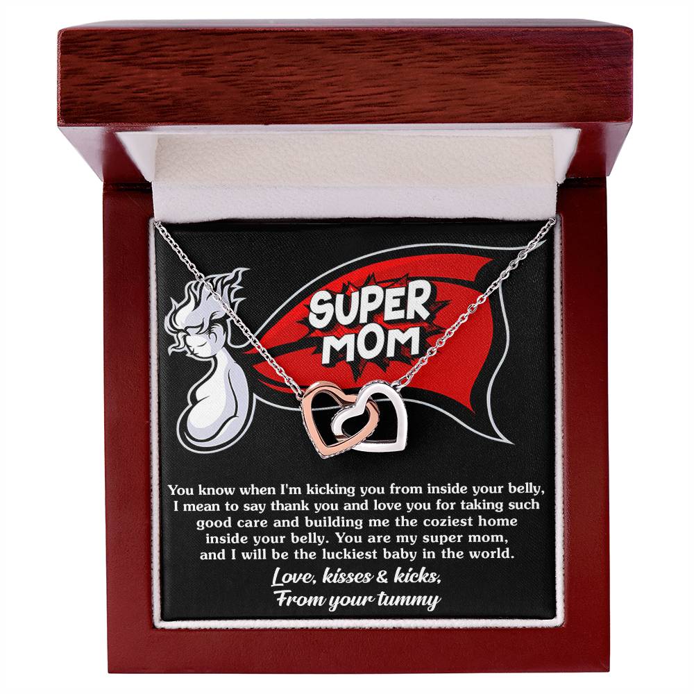 A ShineOn Fulfillment necklace with an "Interlocking Hearts" pendant, encrusted with cubic zirconia, presented in a box featuring a sentimental message for an expectant mother from the unborn baby.