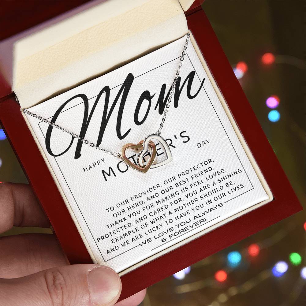 Surprise mom on Mother's Day with the "To Mom, Our Best Friend" necklace: an Interlocking Hearts design with sparkling cubic zirconia crystals, beautifully boxed with a loving message and gently held in hand.
