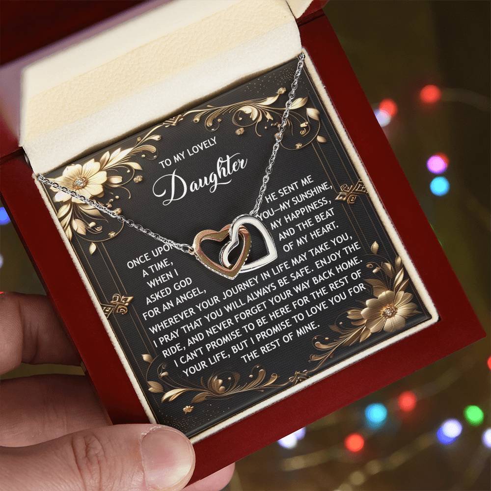 The Daughter-Be Safe - Interlocking Hearts Necklace features floral designs and cubic zirconia crystals. It comes in a red box with a message card for your daughter, and its decorative text is beautifully enhanced by the rose gold finish.
