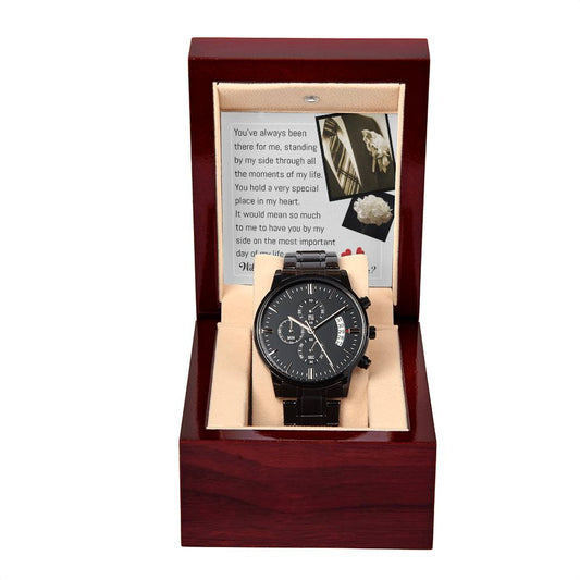 A black "Wedding, Down The Aisle - Metal Chronograph Watch" with a copper dial is displayed in an open dark wooden gift box, with a card inside the lid containing a printed message.