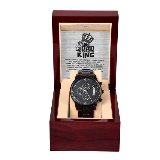 A black To Dad, Not Because - Metal Chronograph Watch displayed in an open wooden box with an engraved plate stating "Dad, You Are The King" and a lion illustration above the text. This sophisticated timepiece, featuring a luxury copper dial, includes a heartfelt message for a father.