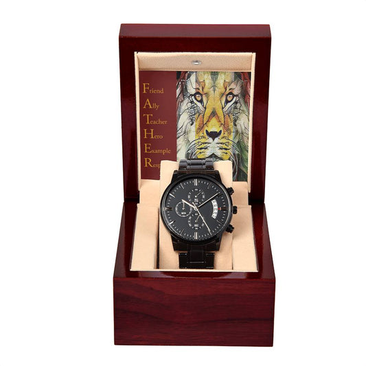 A black To Dad, Respected - Metal Chronograph Watch with a stainless steel bracelet is displayed inside a wooden box. Behind the watch is a card featuring a lion and the word "FATHER" with attributes like Friend, Ally, and Teacher written next to it.