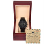 A black chronograph watch called "To Bonus Dad, Heal A Heart - Metal Chronograph Watch" is displayed in an open wooden box. The watch faces an inscribed message on the lid that reads, "To my Bonus Dad" with a heartfelt note underneath.