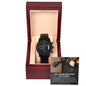 A luxury To Husband, For Each Other - Metal Chronograph Watch in an open wooden display box with a card reading "Best Husband and Father in the World," featuring an image of a bow tie and roses.