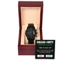 A men's luxury black chronograph watch with three subdials in an open, wooden display box. The box features a card labeled "To Groomsman, Called To Duty - Metal Chronograph Watch, Wedding Edition.