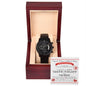 A luxury men's watch, the "To Groom, Date Night - Metal Chronograph Watch," with a black metal strap is displayed in an open wooden box. This elegant timepiece comes with a certificate behind it, featuring the text "DATE NIGHT THE BRIDE.