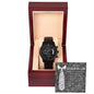 A "To Father-In-Law, Truly Blessed - Metal Chronograph Watch" inside a wooden box with a message card for a father-in-law in the background. The card features a tie design and expresses appreciation. The stainless steel watch has multiple dials, completing an elegant gift presentation.