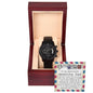A black To Boyfriend's Dad, An Amazing Man - Metal Chronograph Watch is displayed in an open wooden box with a note thanking a boyfriend's father, describing him as an "Amazing Dad" who treats his girlfriend well.