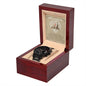 A black metal chronograph watch from the "To Husband, I Choose You" collection is elegantly displayed in an open wooden box. The box features an inscription reading "Today, I Choose You," complemented by additional text and illustrations in the background. The luxurious copper dial enhances the sophistication of this stunning timepiece.