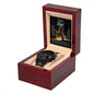 A black chronograph watch with a copper dial, encased in a wooden box with a heartfelt “To Dad, My Lion King - Metal Chronograph Watch” message inside.
