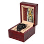 A black To Dad, Respected - Metal Chronograph Watch with a stainless steel bracelet is displayed inside a wooden box. Behind the watch is a card featuring a lion and the word "FATHER" with attributes like Friend, Ally, and Teacher written next to it.