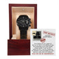 A To Groomsman, Top Secret - Metal Chronograph Watch in an open wooden box. Behind the watch, a "Top Secret" themed note with instructions for a groom's mission in a wedding is displayed.